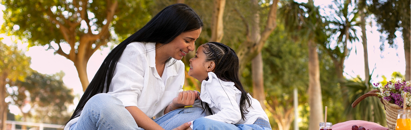 Mother and daughter smiling